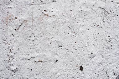 Çatlakları ve çizikleri olan beton bir duvarın dokusu arka plan olarak kullanılabilir.