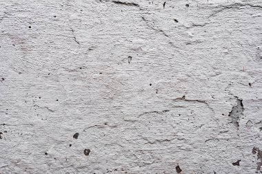 Çatlakları ve çizikleri olan beton bir duvarın dokusu arka plan olarak kullanılabilir.