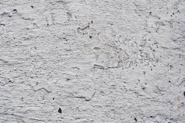 Çatlakları ve çizikleri olan beton bir duvarın dokusu arka plan olarak kullanılabilir.