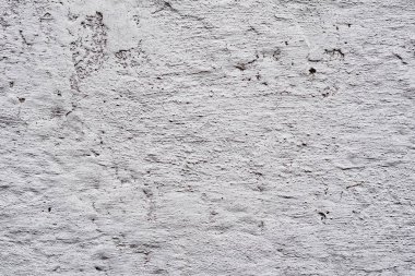 Çatlakları ve çizikleri olan beton bir duvarın dokusu arka plan olarak kullanılabilir.