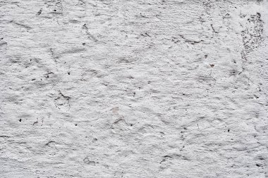 Çatlakları ve çizikleri olan beton bir duvarın dokusu arka plan olarak kullanılabilir.