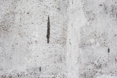 Çatlakları ve çizikleri olan beton bir duvarın dokusu arka plan olarak kullanılabilir.