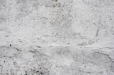 Çatlakları ve çizikleri olan beton bir duvarın dokusu arka plan olarak kullanılabilir.