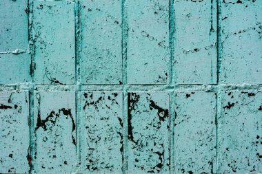 Çatlakları ve çizikleri olan tuğla duvar dokusu arka plan olarak kullanılabilir.