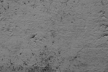 Çatlakları ve çizikleri olan beton bir duvarın dokusu arka plan olarak kullanılabilir.