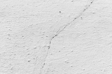 Çatlakları ve çizikleri olan beton bir duvarın dokusu arka plan olarak kullanılabilir.