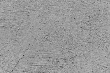 Çatlakları ve çizikleri olan beton bir duvarın dokusu arka plan olarak kullanılabilir.
