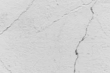 Çatlakları ve çizikleri olan beton bir duvarın dokusu arka plan olarak kullanılabilir.