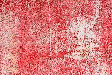 Çatlakları ve çizikleri olan metal bir duvarın dokusu arka plan olarak kullanılabilir.