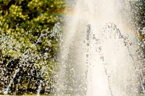 Blurred drops from a water fountain, defocus light, blur bokeh