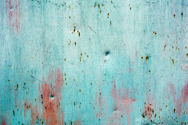 Eski metal duvar arkaplanı. Eski metal bir yüzeyde yeşil boya çatlamış.