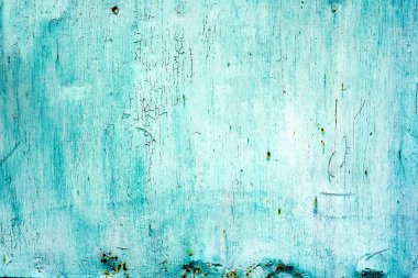 Eski metal duvar arkaplanı. Eski metal bir yüzeyde yeşil boya çatlamış.