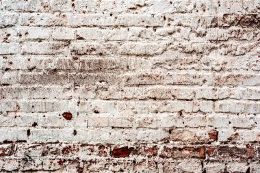 Çatlakları ve çizikleri olan tuğla duvar dokusu arka plan olarak kullanılabilir.