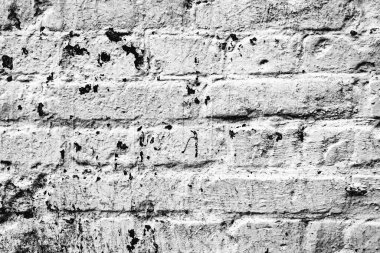 Çatlakları ve çizikleri olan tuğla duvar dokusu arka plan olarak kullanılabilir.