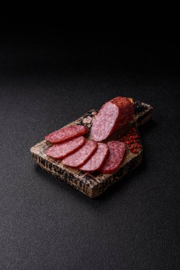 Sliced salami sausage, smoked meat as a delicacy for the table. Salami sausage as a food background for your design.