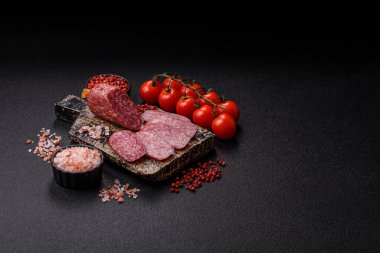 Sliced salami sausage, smoked meat as a delicacy for the table. Salami sausage as a food background for your design.