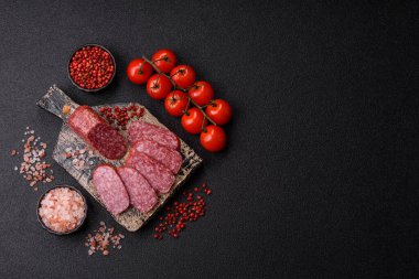 Sliced salami sausage, smoked meat as a delicacy for the table. Salami sausage as a food background for your design.