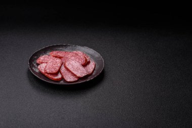 Sliced salami sausage, smoked meat as a delicacy for the table. Salami sausage as a food background for your design.