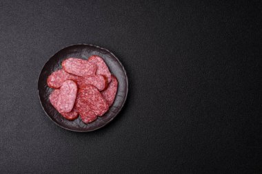 Sliced salami sausage, smoked meat as a delicacy for the table. Salami sausage as a food background for your design.