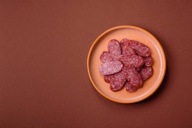 Sliced salami sausage, smoked meat as a delicacy for the table. Salami sausage as a food background for your design.