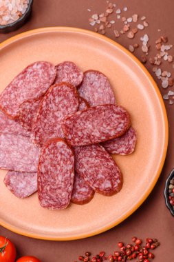 Sliced salami sausage, smoked meat as a delicacy for the table. Salami sausage as a food background for your design.