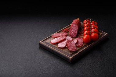 Sliced salami sausage, smoked meat as a delicacy for the table. Salami sausage as a food background for your design.