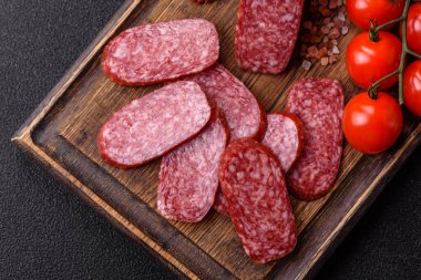 Sliced salami sausage, smoked meat as a delicacy for the table. Salami sausage as a food background for your design.