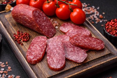 Sliced salami sausage, smoked meat as a delicacy for the table. Salami sausage as a food background for your design.