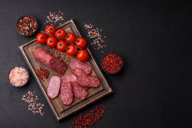 Sliced salami sausage, smoked meat as a delicacy for the table. Salami sausage as a food background for your design.