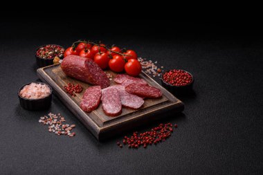 Sliced salami sausage, smoked meat as a delicacy for the table. Salami sausage as a food background for your design.
