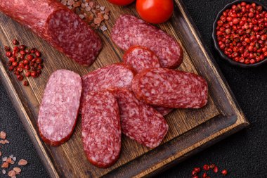 Sliced salami sausage, smoked meat as a delicacy for the table. Salami sausage as a food background for your design.