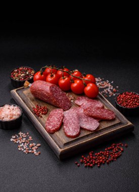 Sliced salami sausage, smoked meat as a delicacy for the table. Salami sausage as a food background for your design.