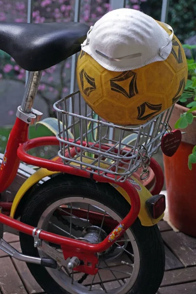 Child Bicycle Home Balcony Soccer Ball Mask Cov19 Coronavirus Closure — Stock Photo, Image