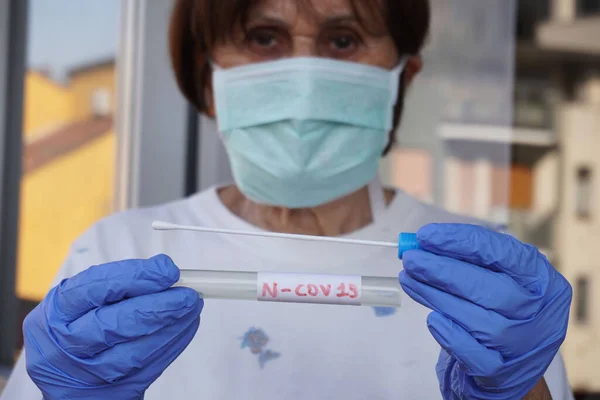 close-up of a female doctor in a laboratory with a covid test