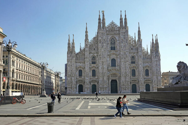Royalty-free stock photo ID: 1843931410ITALY, MILAN, October 2020: End of quarantine lockdown covid19 Coronavirus, People with masks walking in Duomo Cathedral Square - downtown empty of tourists - Vittorio Emanuele horse statue