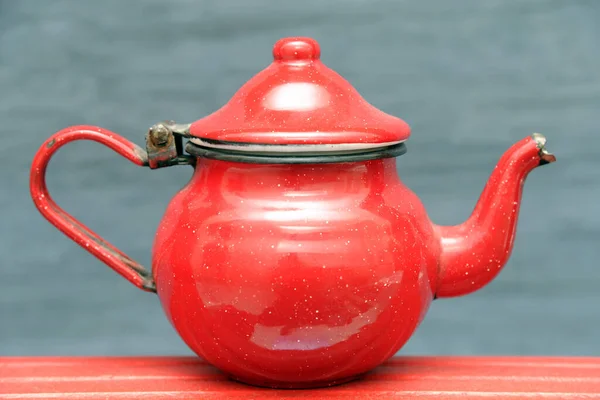 old vintage red teapot, Moroccan and Turkish tea in mind, red object typical of the world and of the Arab tradition