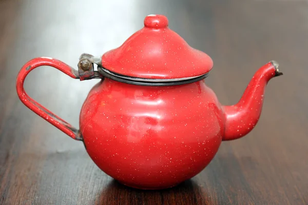 old vintage red teapot, Moroccan and Turkish tea in mind, red object typical of the world and of the Arab tradition