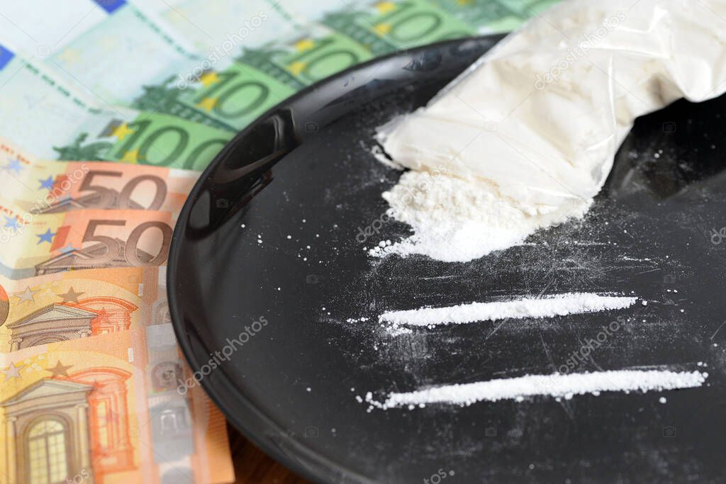 cocaine with us euros banknotes, addiction and substance abuse concept
