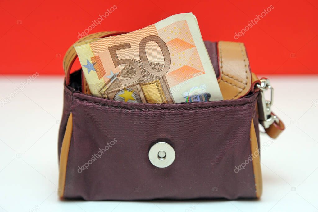 small purse for money with 50 euros cash banknote - savings