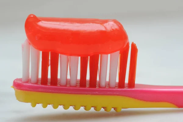 Red Plastic Toothbrush White Background Closeup — Stock Photo, Image