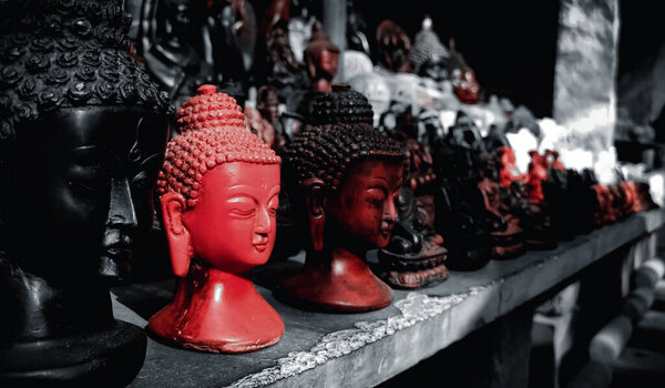 Black and Red Lord Gautama buddha sculptures