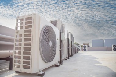 Air conditioning (HVAC) installed on the roof of industrial buildings.