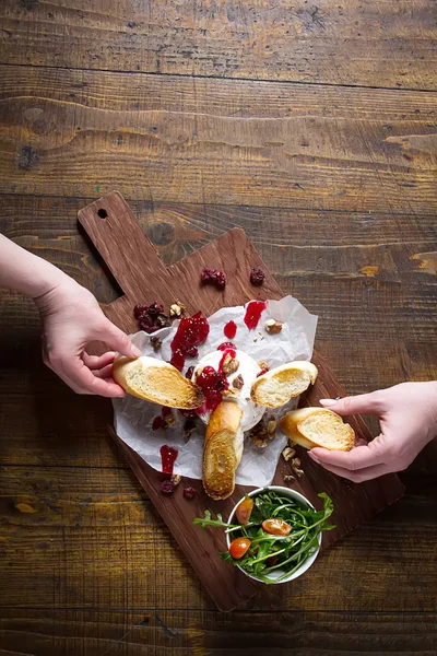 Grilled cheese with toast and sauce. Dark wooden background