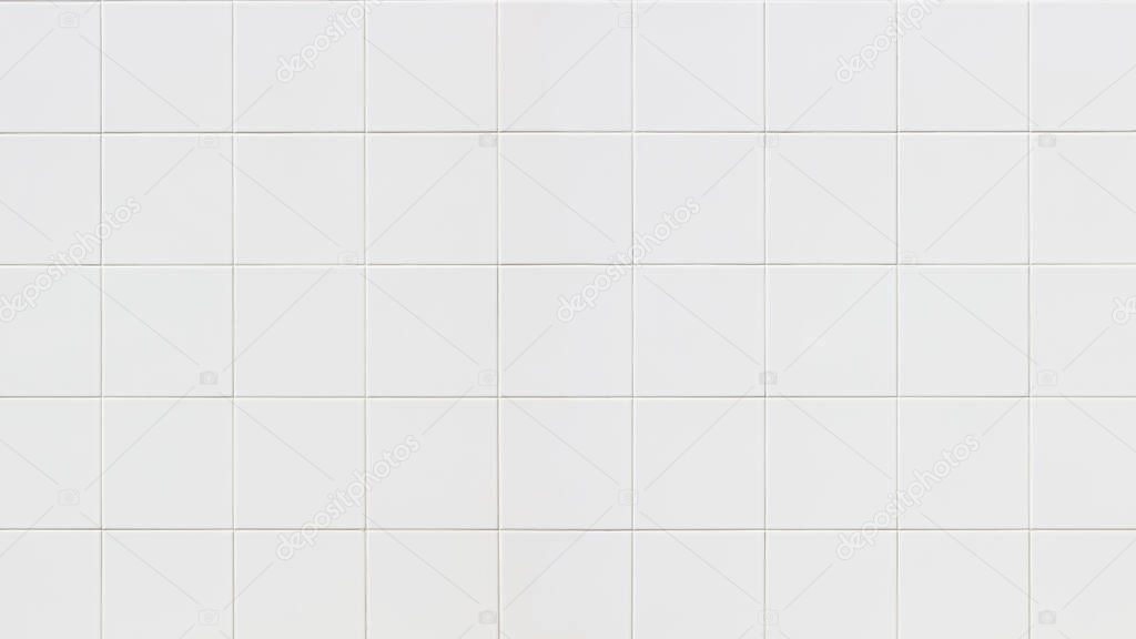 White ceramic tiles wall texture for the decoration of the bedroom.