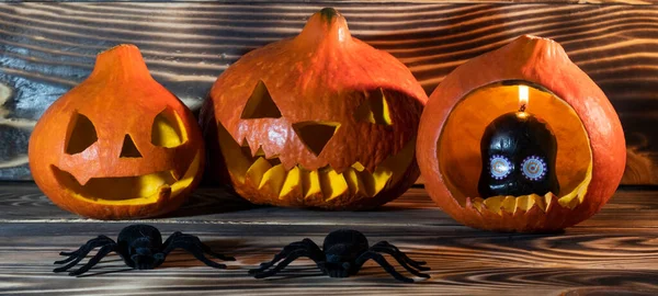 Halloween pumpkin head jack lantern on wooden background. Halloween card.