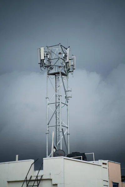 Cell Phone Tower with dark cloudy background on a Rainy day