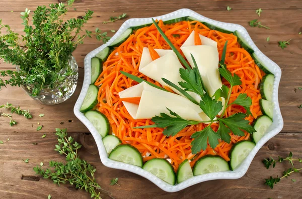 Layered salad with Korean carrot with spring decoration Calla lilly. Decoration is made of cheese, green onions, parsley and carrots