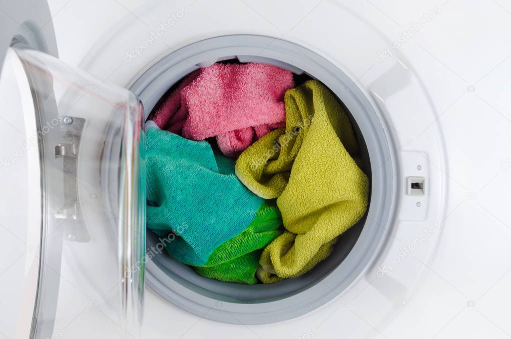 washing machine with color towels, clothes, open