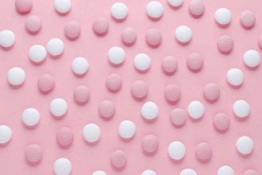pembe ve beyaz şeker veya pastel renk arka plan, soyut desen hapları