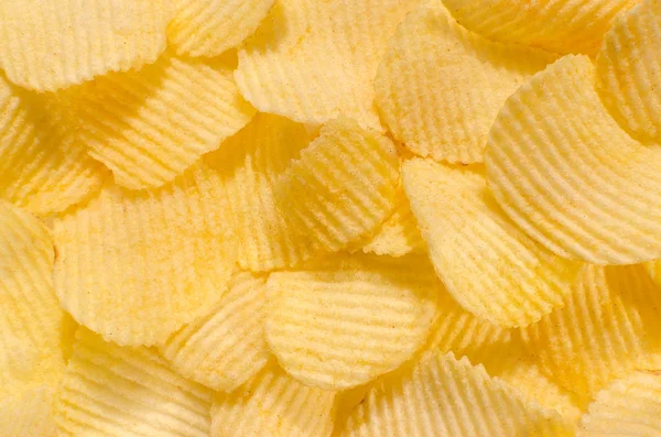 Gouden knapperige chips, voedsel achtergrond, close-up — Stockfoto